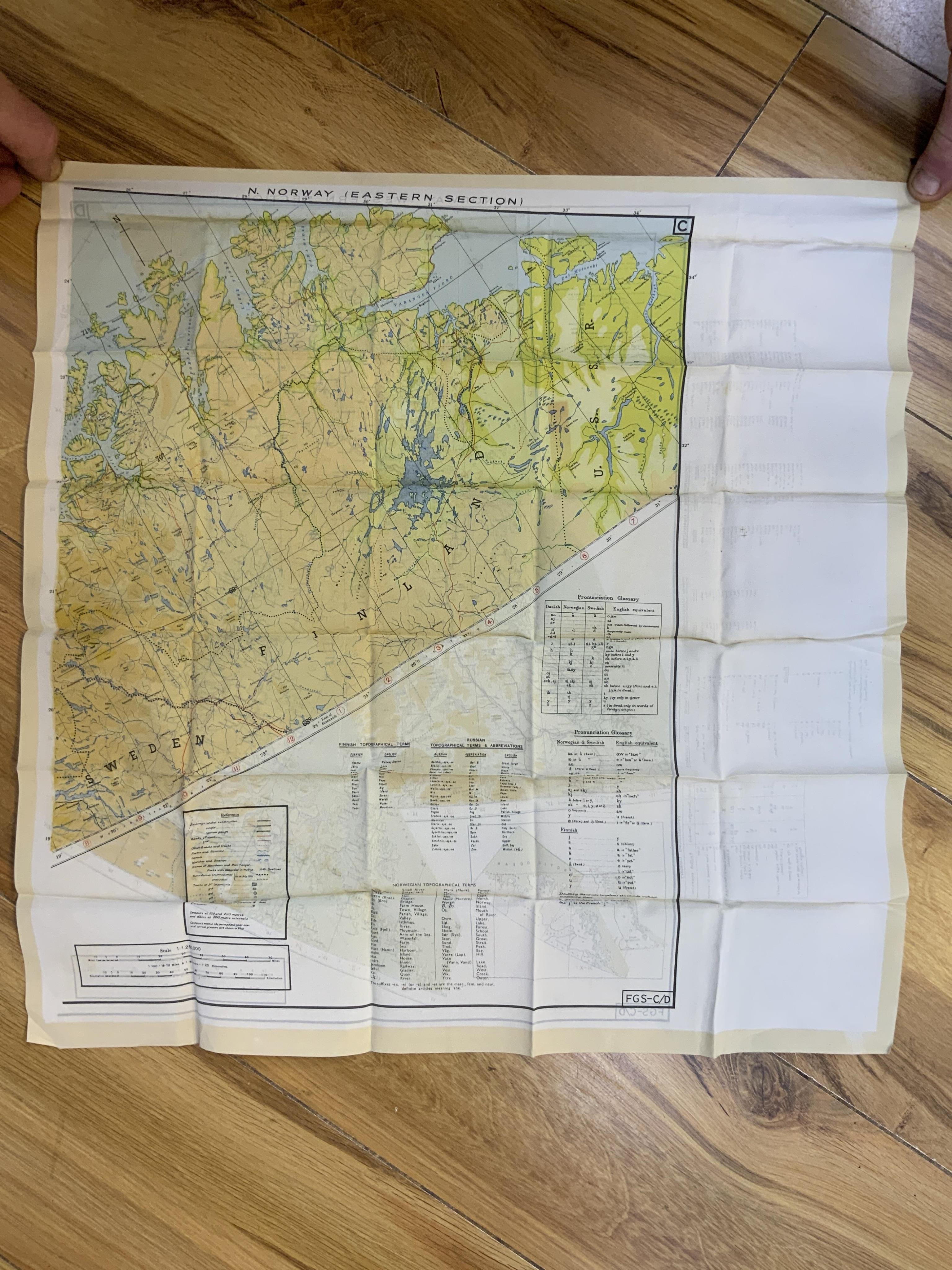 Four ‘escape’ style maps printed on silk type material, three printed double-sided; North Norway, 47x49cm, parts of Italy and Greece, 53x62cm, parts of France, 44x53cm, and a single sided map of part of the Mediterranean